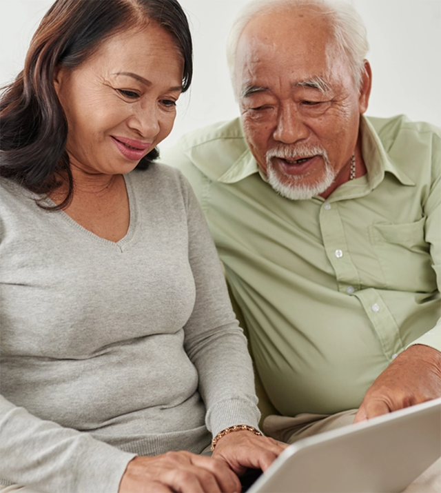 A couple working on a laptop