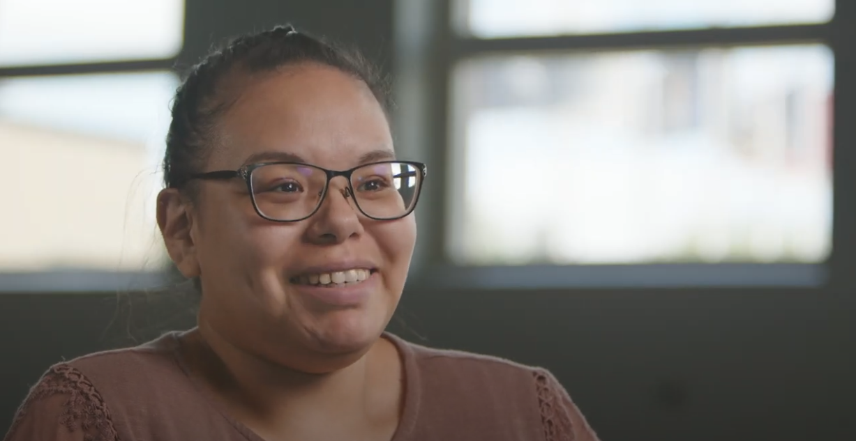 Lady smiling while telling her story