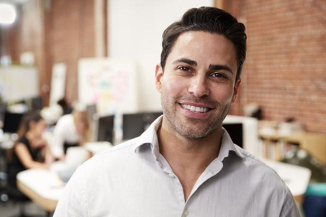 man in front of people collaborating 